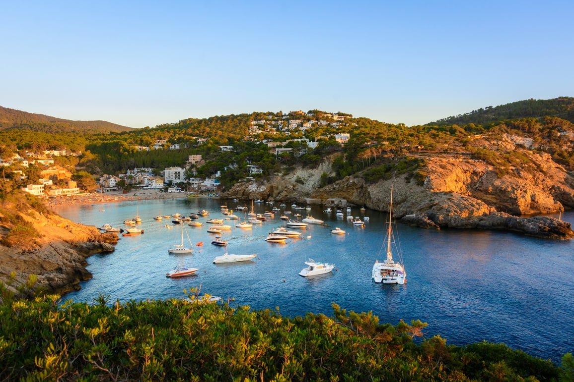 Sunset in the small bay of Cala Vedella, Ibiza island.